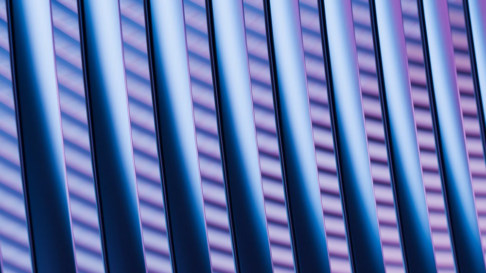 Close-up of blue metallic rods arranged in parallel with purple striped shadows and gradient lighting creating an abstract geometric pattern.