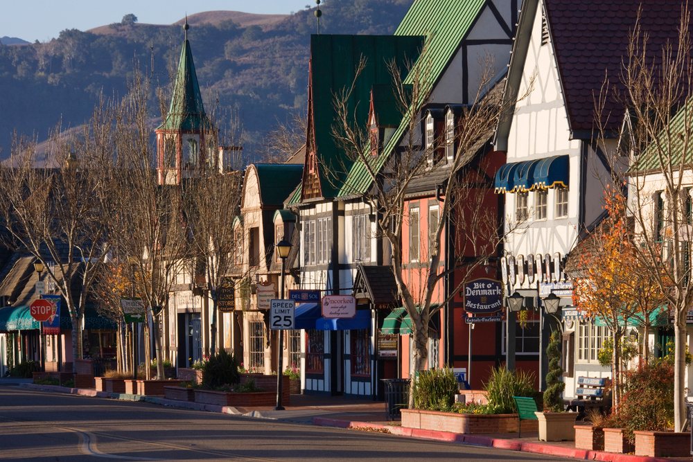 Historic european-style street scene with church steeple, Southern California, USA.