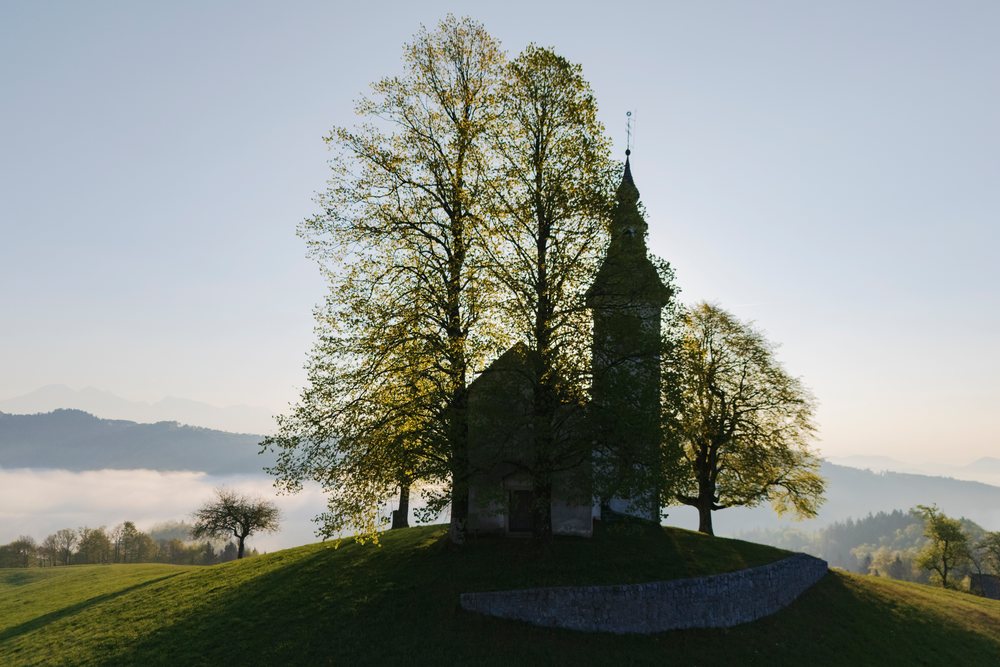 St Thomas's Church on a hill at Sunrise, landscape, cityscape, Škofja Loka, Slovenia.