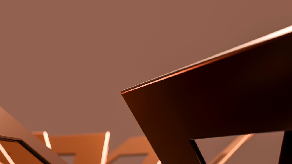 Abstract geometric metal sculpture with orange reflections and curved smooth surfaces against a brown background.