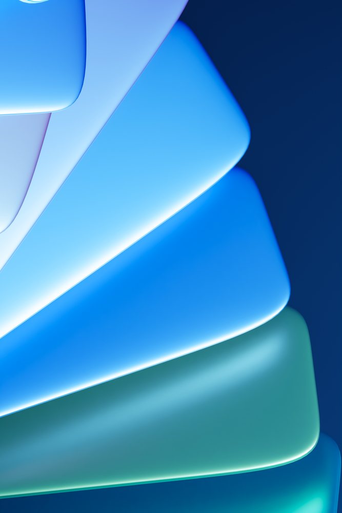 Abstract illustration featuring curved blue and green shapes with soft glowing edges on a dark background.