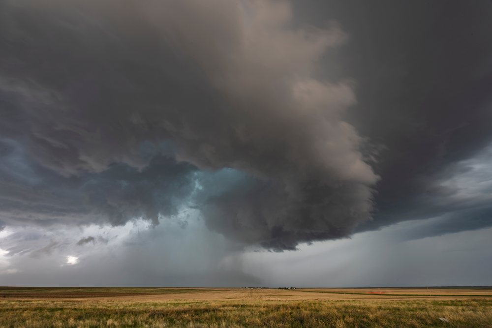 Tornado-warned Supercell storm forms over flat grasslands of Merino in the Great Plains, Colorado, USA.