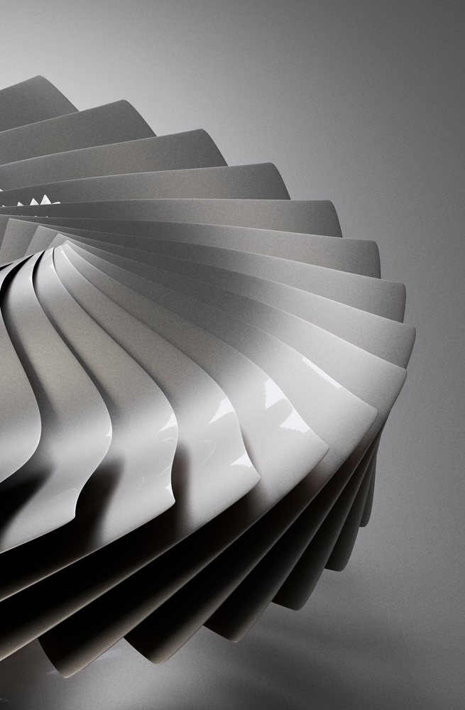 Abstract modern sculpture featuring curved, smooth gray shapes spiraling in a minimalist design with reflective surface.