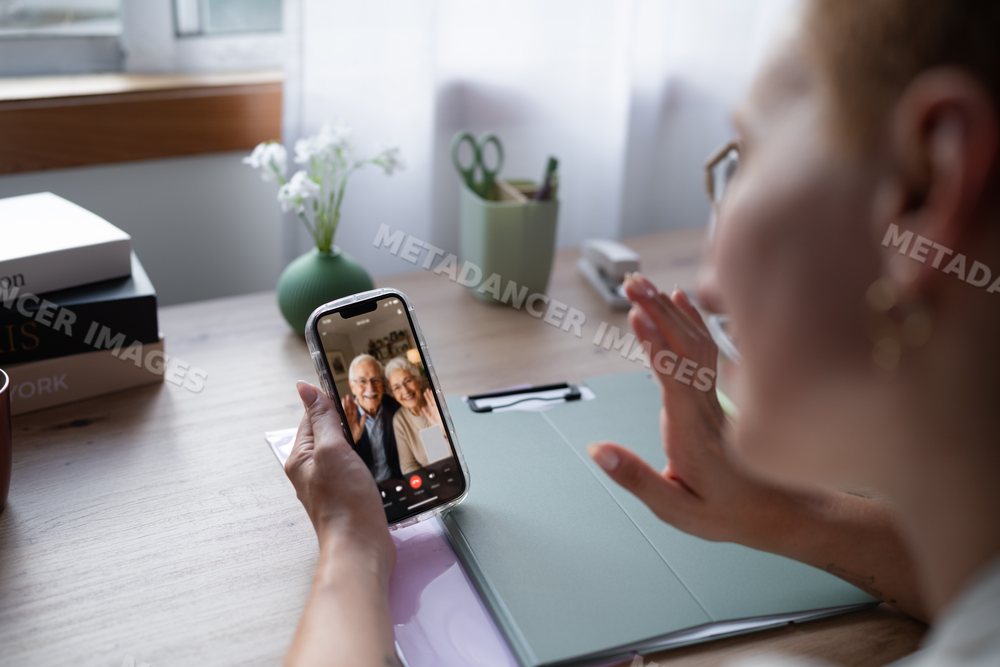 White Woman video calls elderly couple