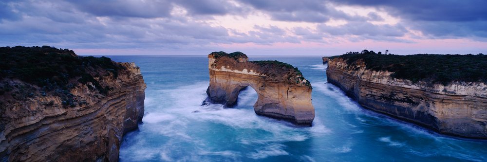 Natural Island Arch rock formation with surrounding ocean and cliffs Victoria, Island Arch Port Campbell National Park Victoria, Australia.