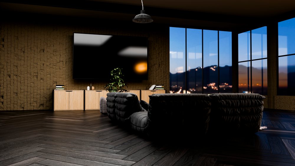 Modern living room with large panoramic windows showcasing a mountain and city sunset view.