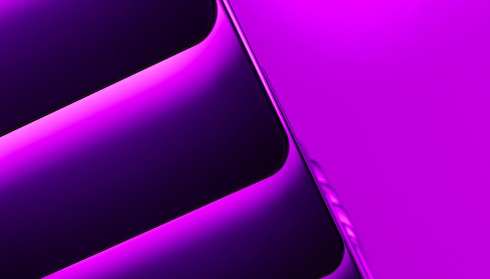 Close-up of a mobile phone with a glossy black screen and purple side buttons against a purple background.