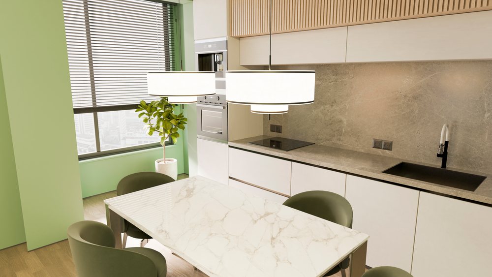 Modern kitchen with marble table, green chairs, white cabinets, and built-in appliances under natural light.