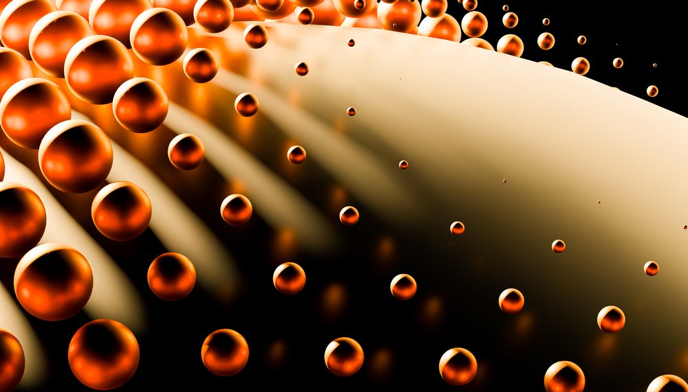 Abstract digital 3D rendering of floating glossy orange spheres with smooth shapes against a dark background.
