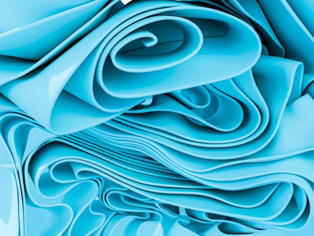 Close-up view of smooth blue folds creating an abstract layered pattern.