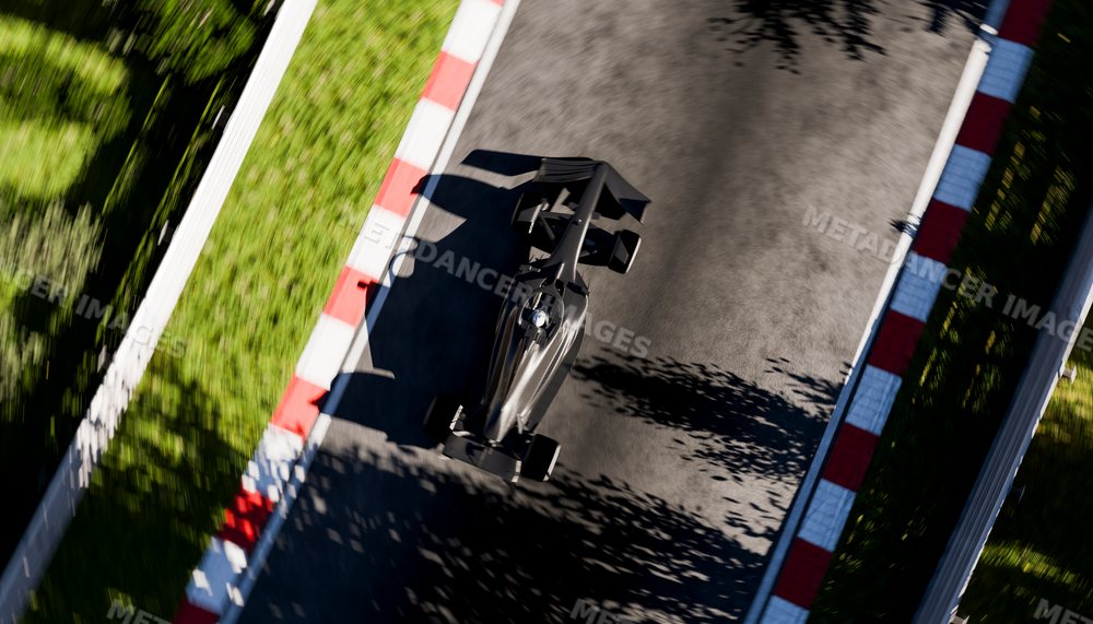 A black open-wheel race car racing on a curved asphalt track section