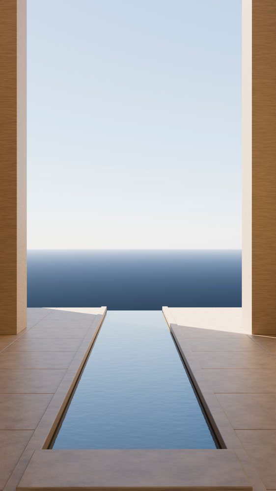 Rectangular infinity pool with beige tiled decking overlooking calm ocean under clear blue sky in a modern minimalist architectural setting.