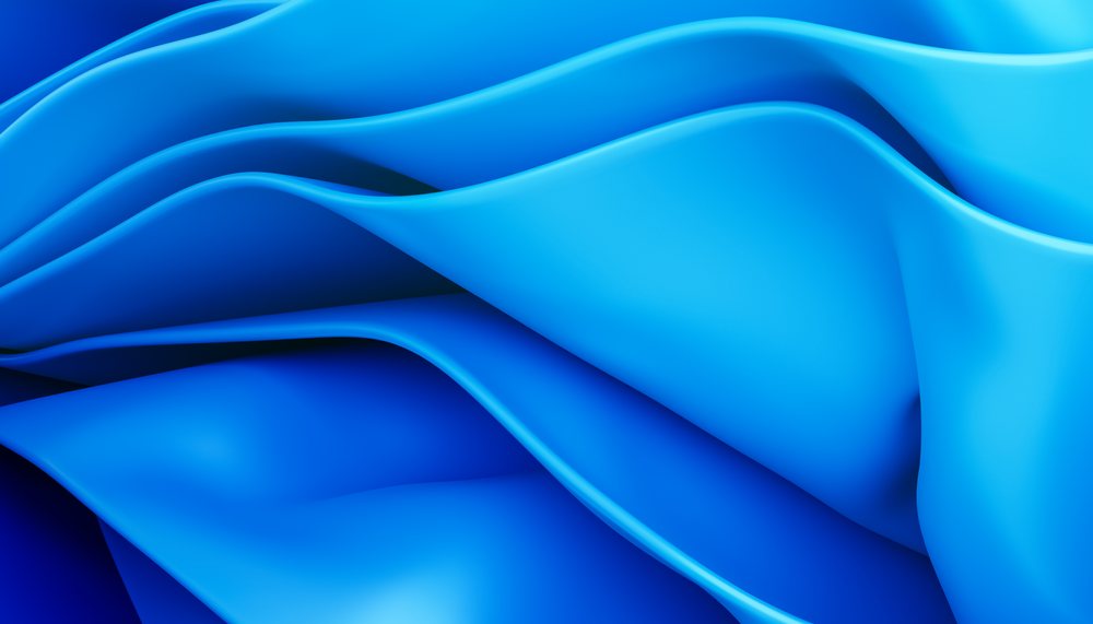 Blue smooth curved folds create an abstract flowing modern background, soft wave-like texture.