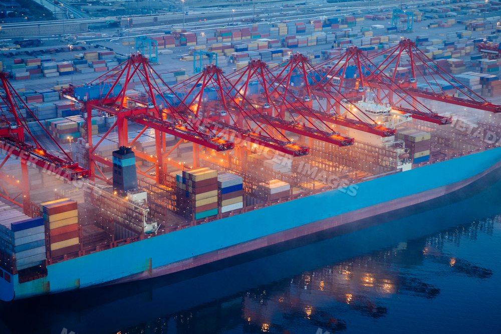 A container ship is loaded with cargo containers