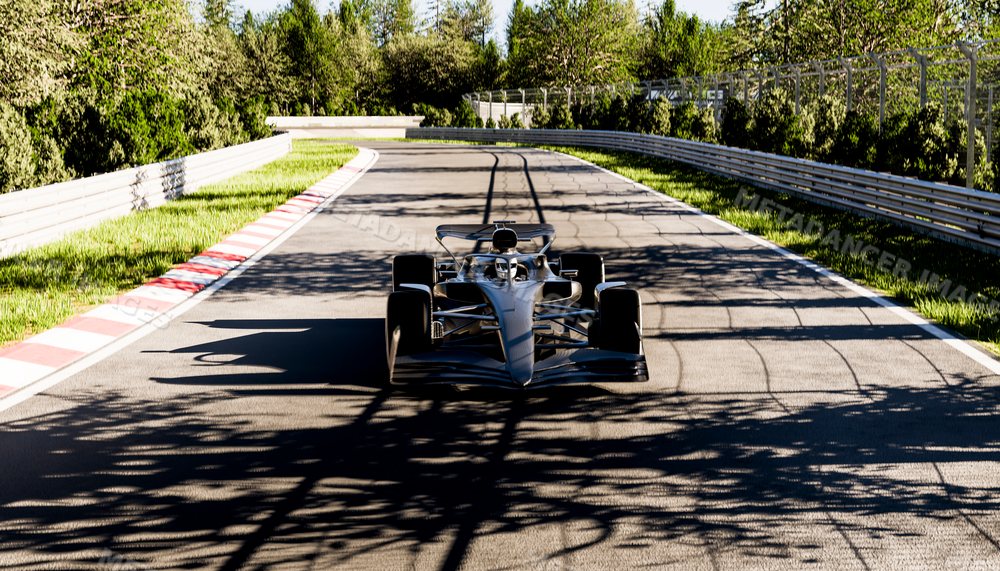 A black open-wheel race car driving on a race track surrounded