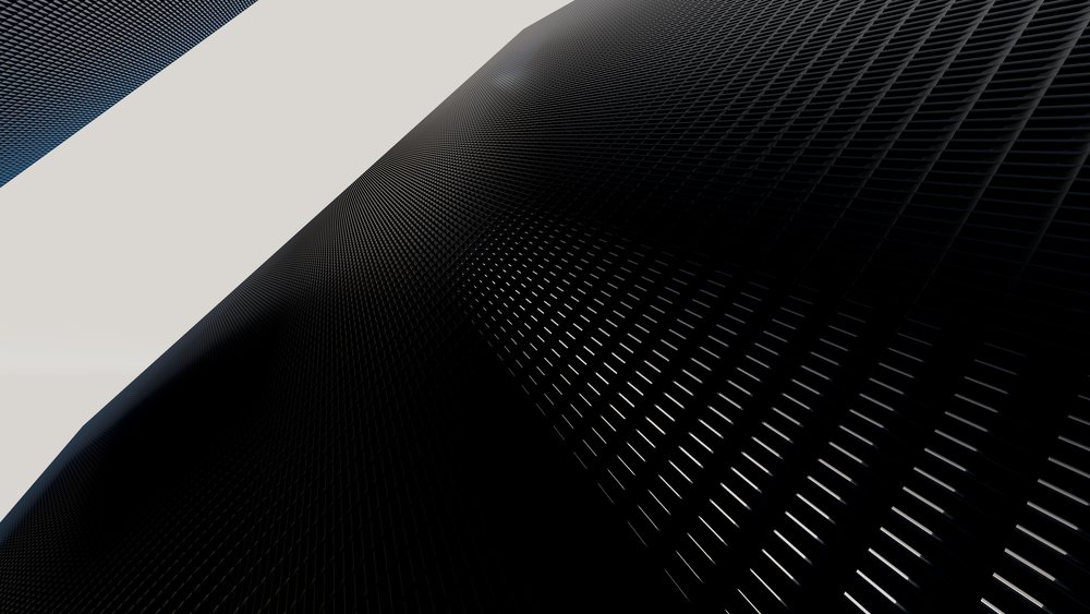 Black modern building facade featuring a grid-patterned exterior with geometric design under natural light.