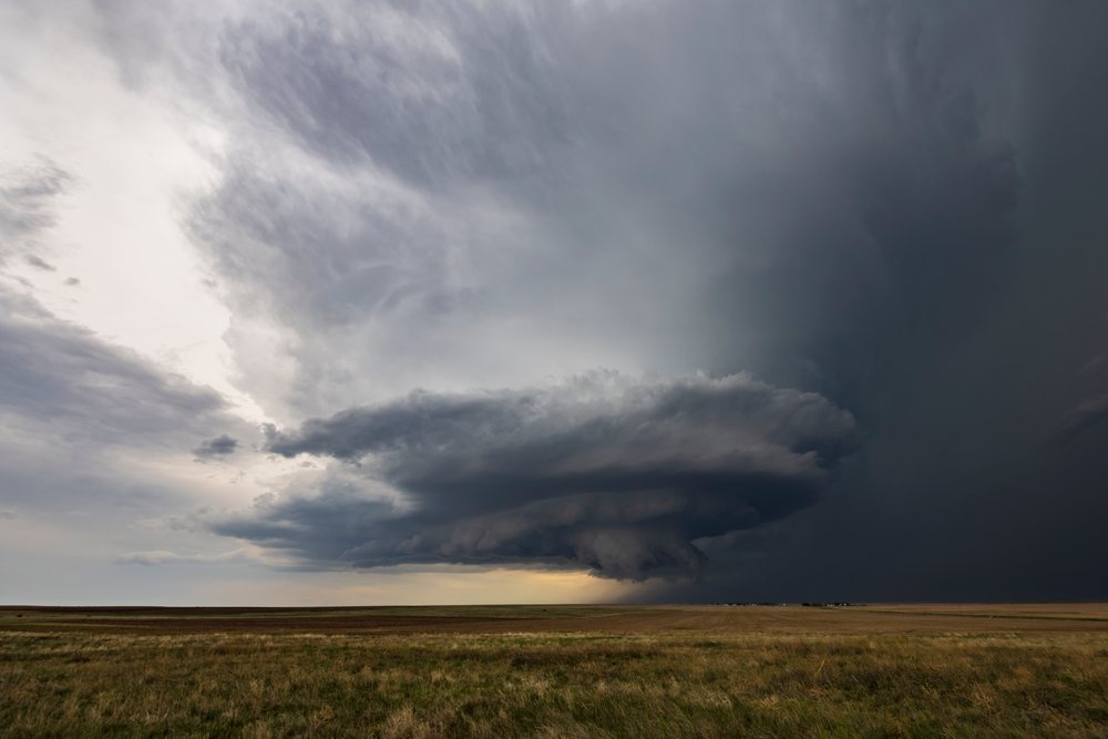 Supercell storm cloud forming over grassland, in the USA's Tornado Alley Great Plains region, Merino, Colorado.