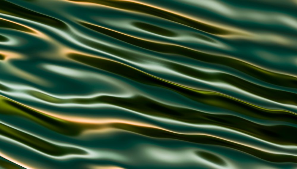 Water surface with ripples and reflections creating a wavy texture.