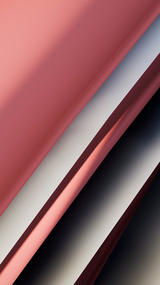 Folded pink, white, and black fabric with visible folds and smooth texture in a studio setting.