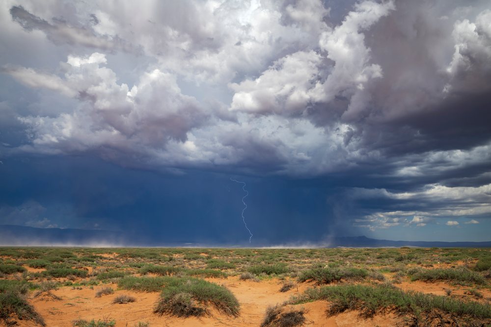 Storm clouds with lightning over a desert landscape, Alamogordo, New Mexico, USA.