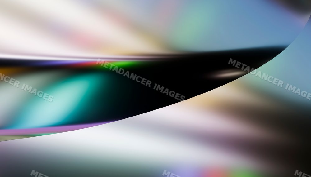 Abstract close-up of a curved shiny surface with colorful light