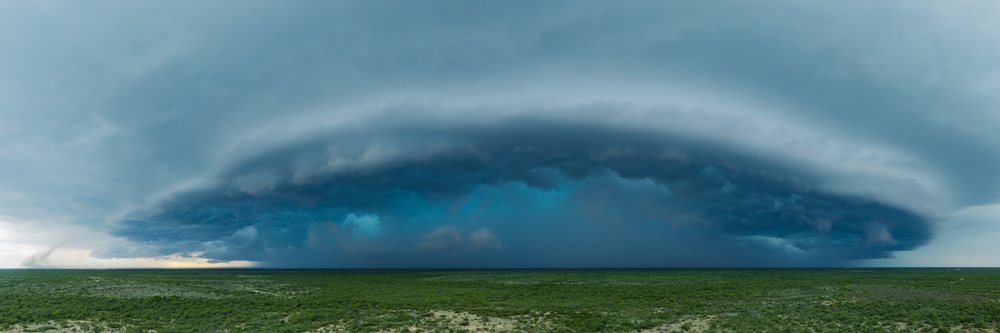 Supercell thunderstorm with distinct rotating updraft over flat, green landscape, Storm Chasing, Weather, Environment, Del Rio, Texas, USA.