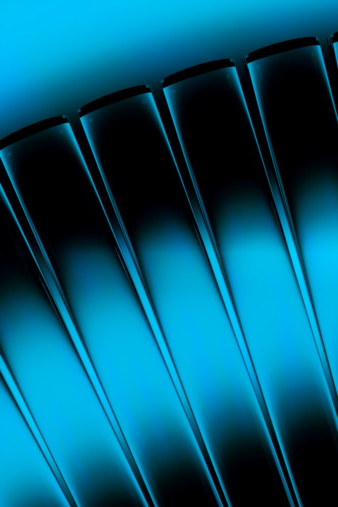 Closeup of curved blue glass panels forming an abstract reflective textured pattern.
