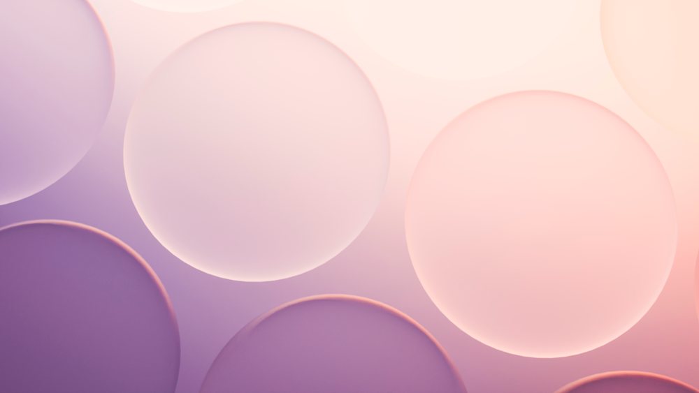 Abstract illustration featuring multiple large translucent glowing pastel spheres overlapping on a smooth gradient background with soft lighting effects.