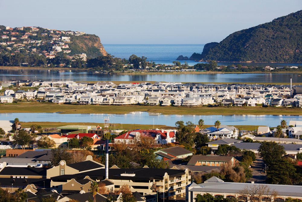 Scenic view of Knysna town by a large lagoon, Western Cape, South Africa.