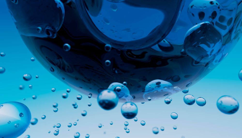 Close-up view of floating blue water bubbles captured underwater showing details of surface tension.
