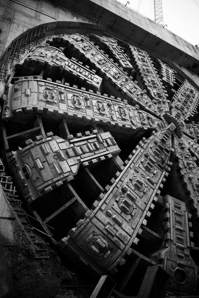 Black and white photo of a tunnel boring machine at a construction site, a tunnel boring machine, drilling, USA.
