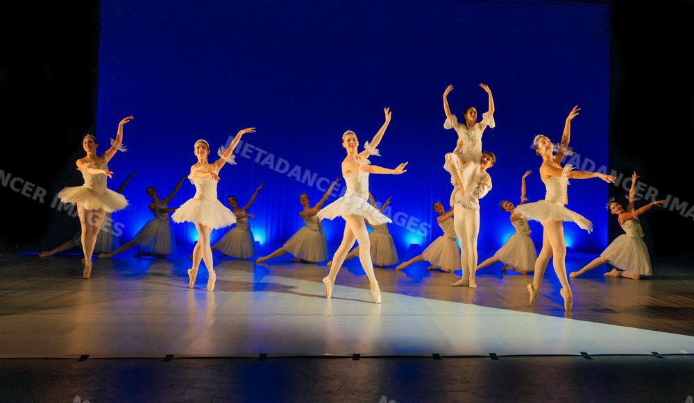 Ballet dancers perform a holiday-themed ballet on stage