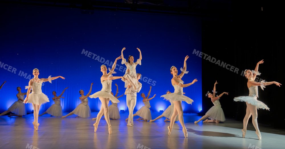 Ballet dancers perform a lifted scene from a traditional holiday