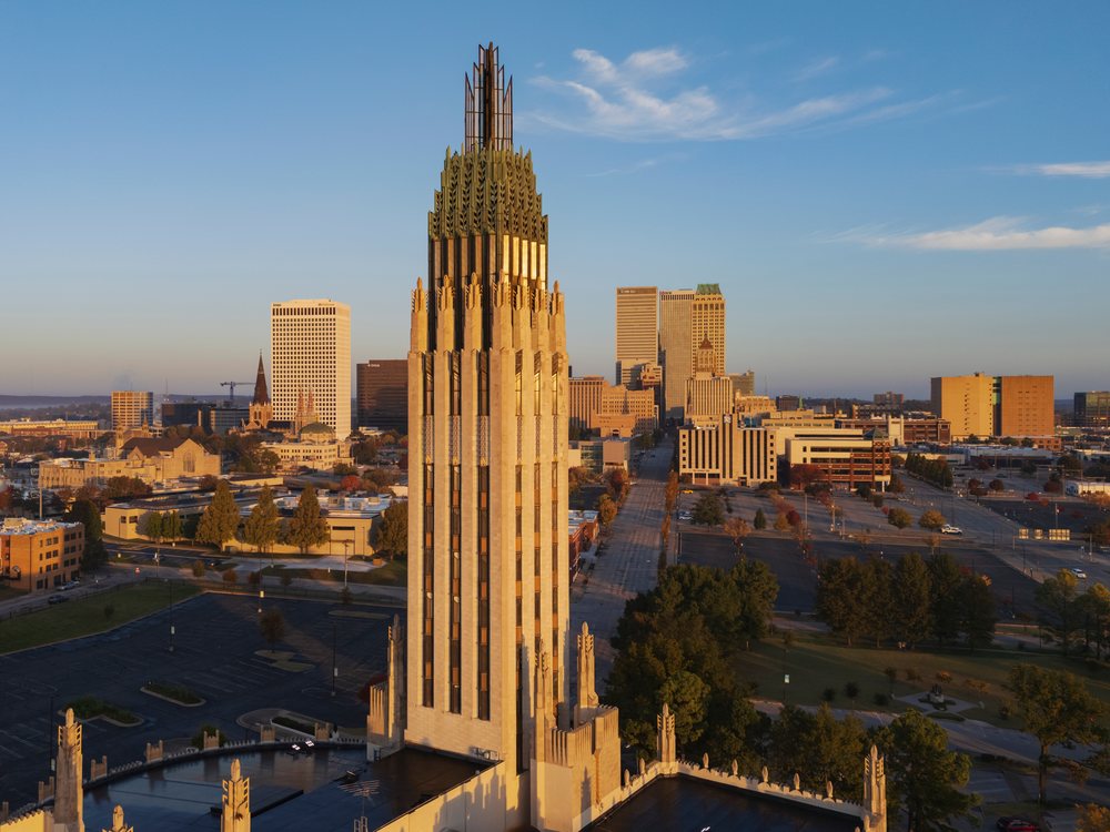 Tulsa skyline at Sunrise with downtown skyscrapers, historic buildings along Route 66, and urban green spaces, Oklahoma, USA.