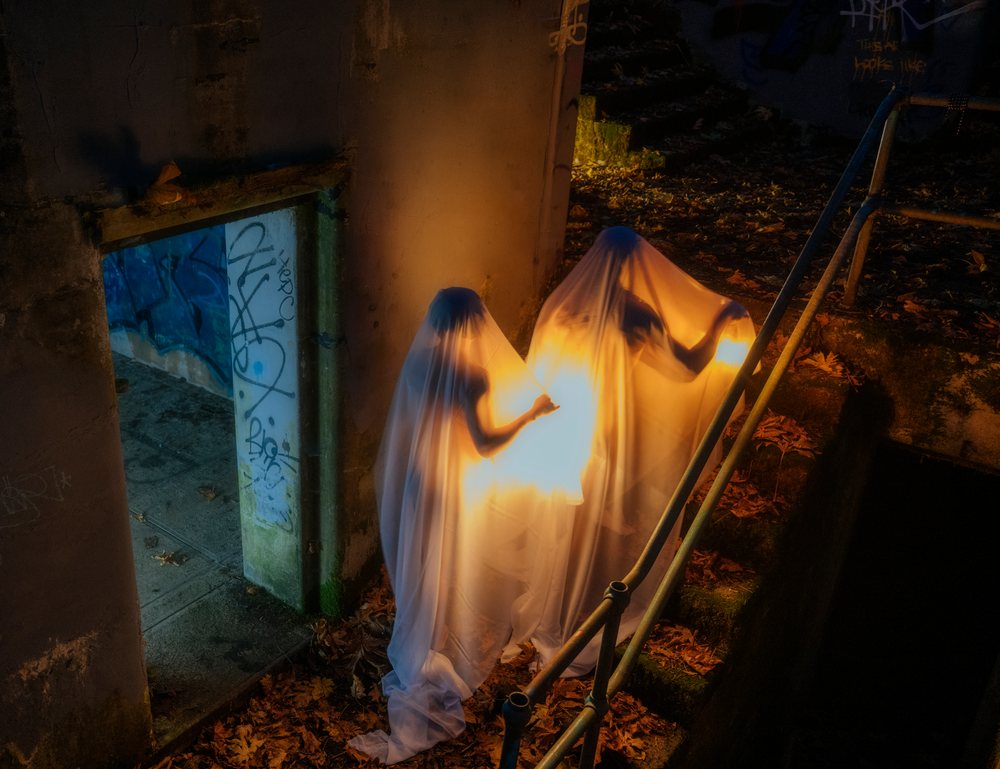 Ghostly figures clad in white sheets stand, ghosts, USA.