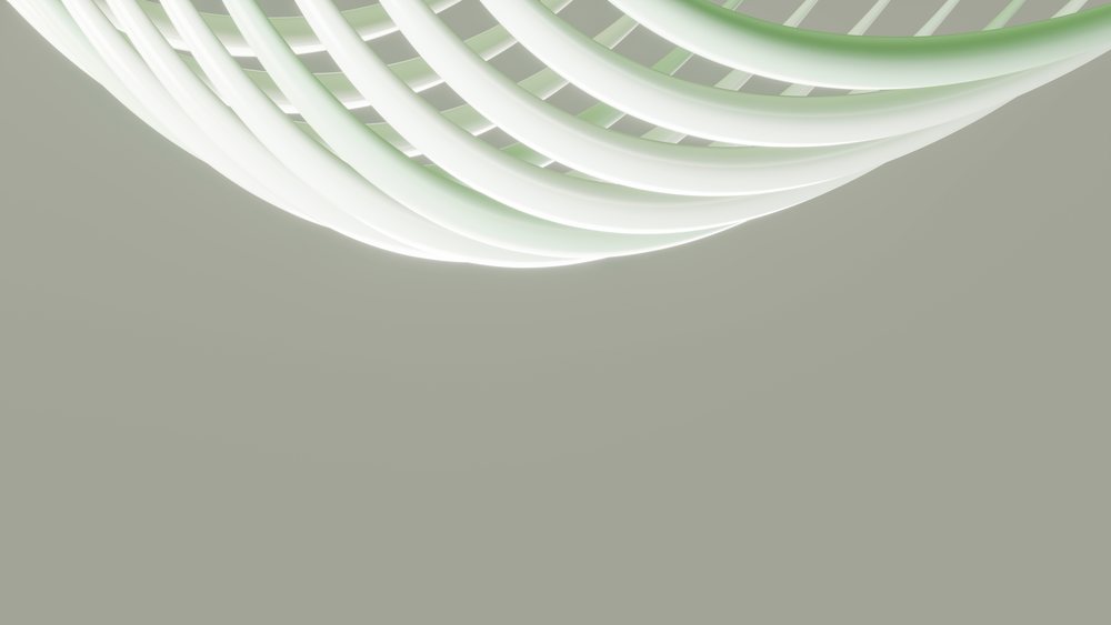 White spiral staircase with smooth curves and decorative handrail in modern indoor architectural setting.