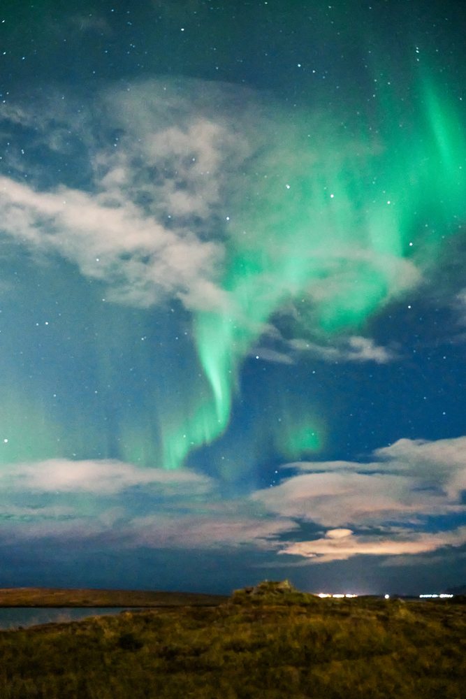 Aurora borealis lights up the night sky over Iceland landscape