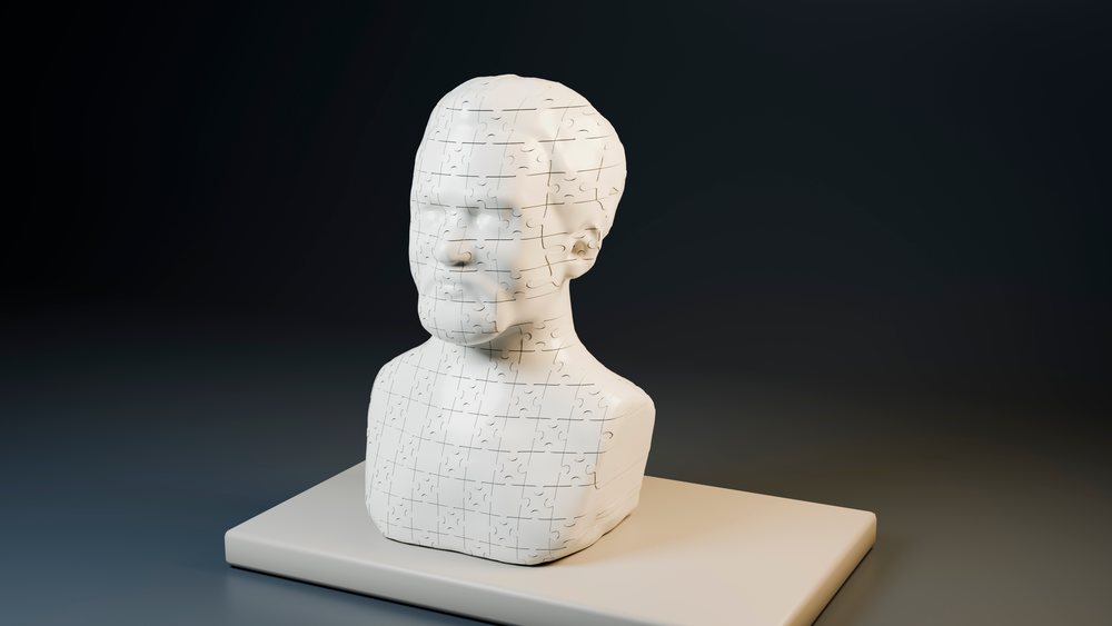 3D rendered white puzzle bust of a human head placed on a rectangular base with a dark seamless background.