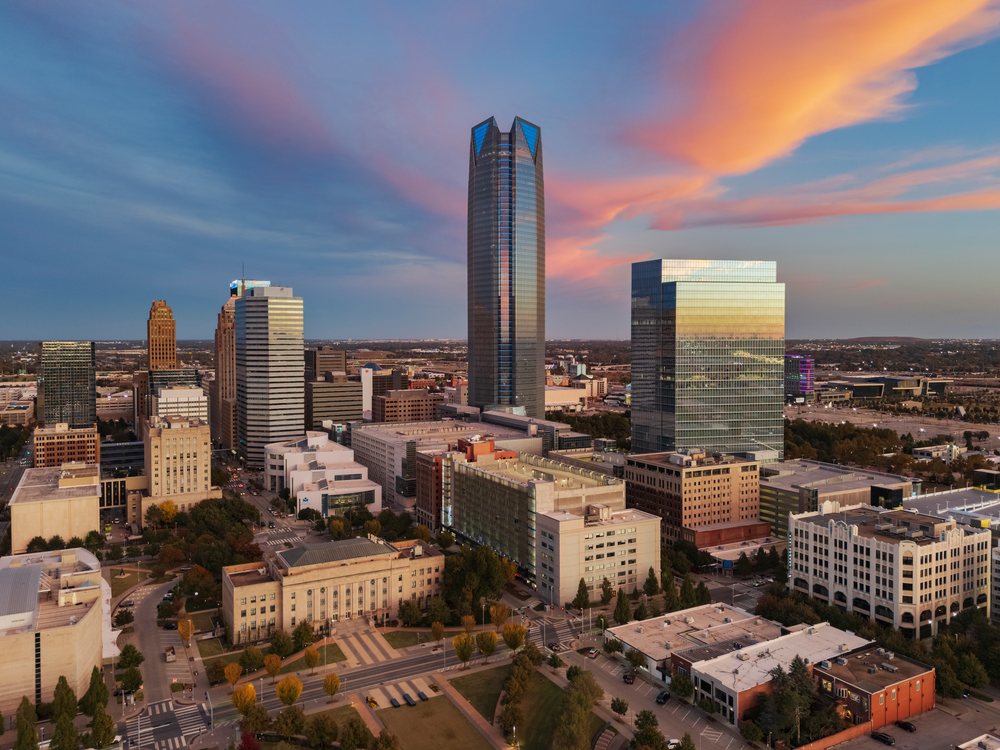 Oklahoma City skyline at Sunset with skyscrapers reflecting warm light and colorful clouds in the sky, Americana, Historic, USA.