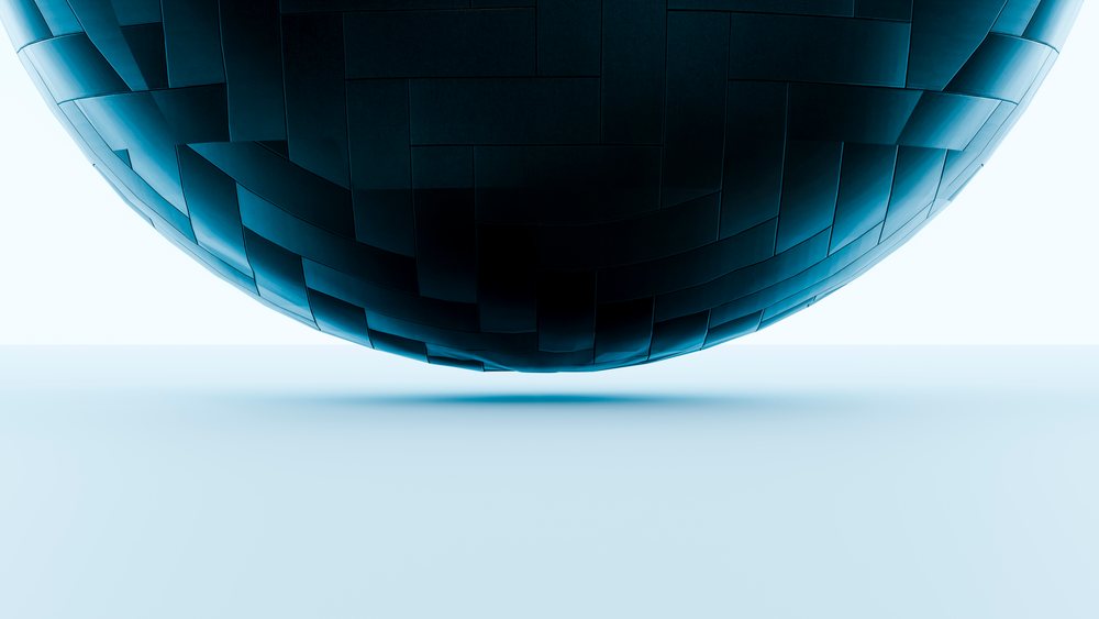 Blue metallic geometric sphere with panels floats above a smooth surface casting a shadow in minimalist digital art.