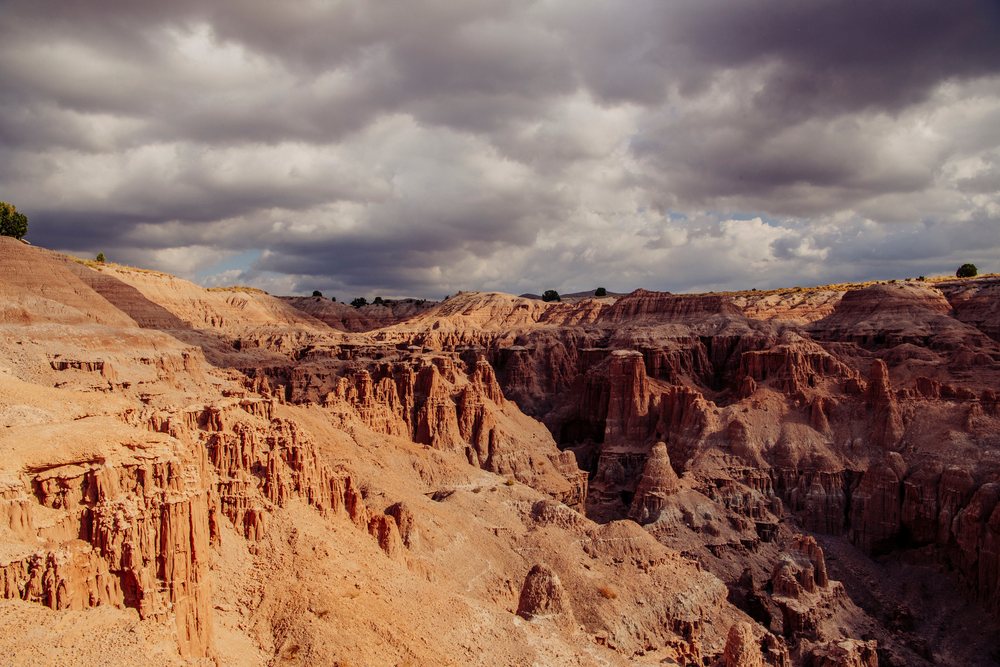 Sandstone rock formations and canyons under a cloudy sky, Cathedral Gorge State Park, Nevada, USA.
