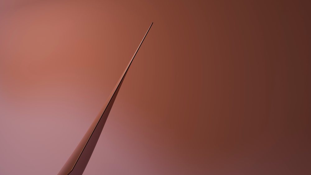 Abstract pointed geometric metallic shape on a brown gradient background in a modern art studio.