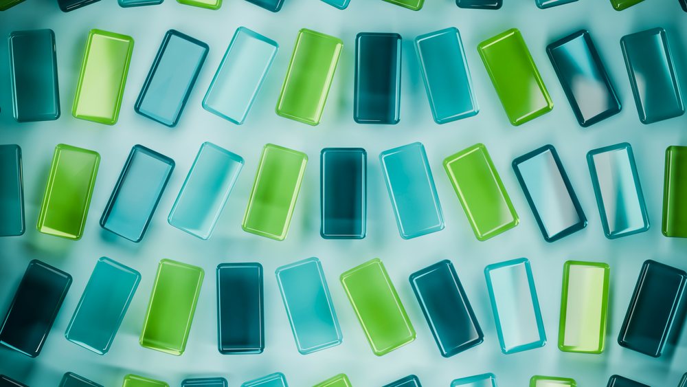 Blue and green translucent glass rectangles form a repeating geometric pattern placed flat on a blue surface in a digital illustration.
