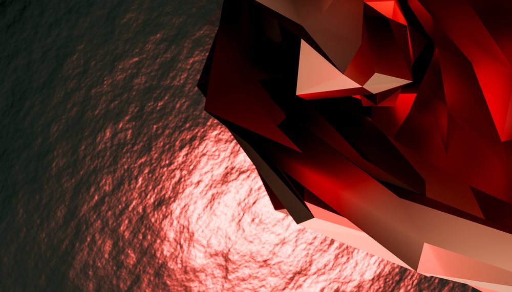 Abstract red polygonal 3D shape with angular facets and reflective surface against a dark background.