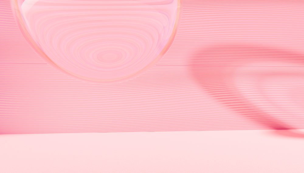 A glass lens creates a shadow pattern on a pink textured surface