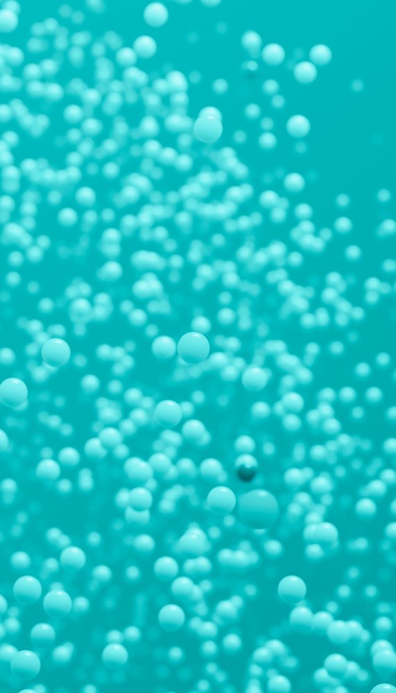 Randomly arranged blue spheres float against a turquoise background forming an abstract modern pattern.