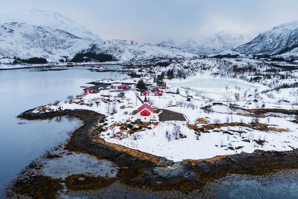 Sildpollnes Church with a red roof stands, Landscape, Svolvaer, Lofoten, Norway.