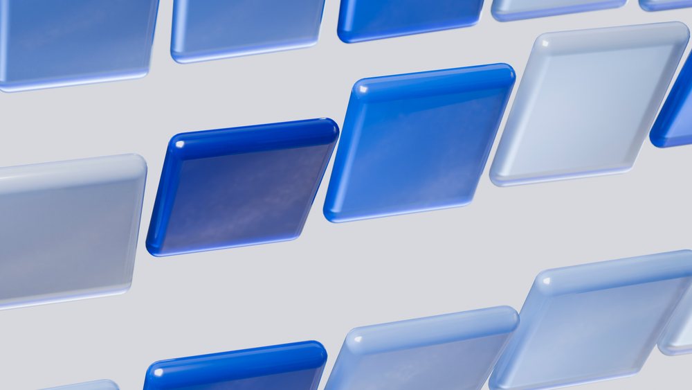 Blue square buttons with glossy surfaces arranged in a grid forming a modern digital user interface design.