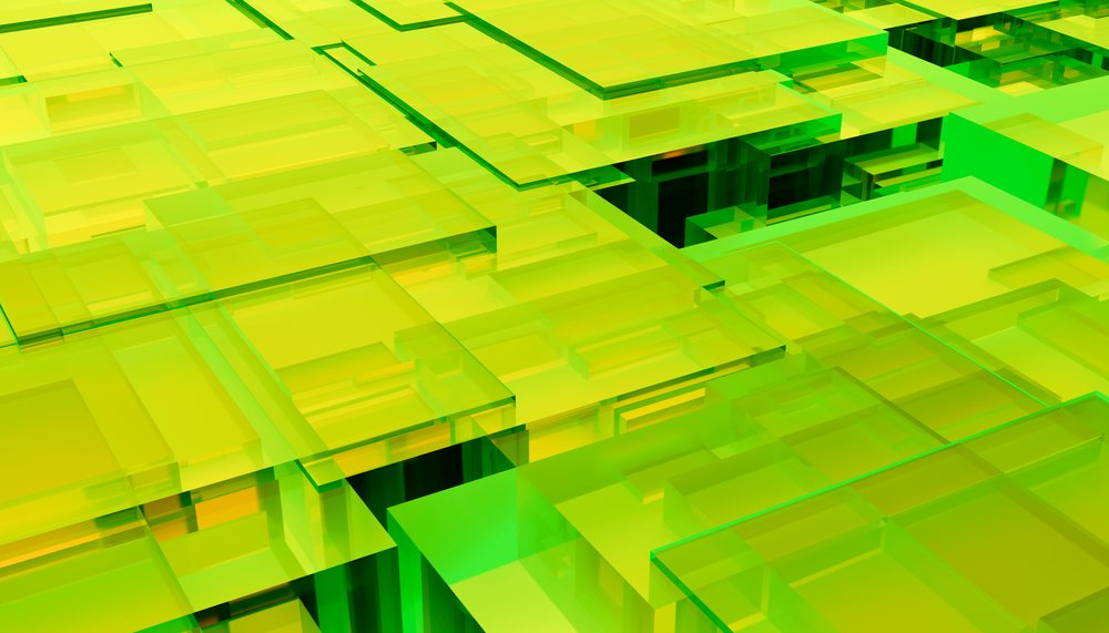 abstract pattern of green and yellow transparent glass blocks forming a geometric modern design.