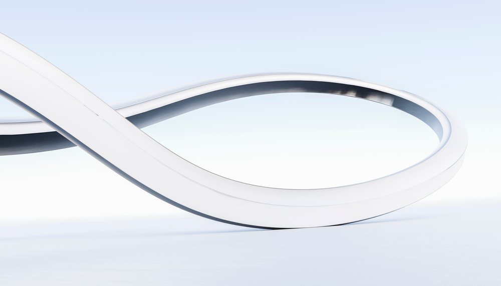 White 3D infinity symbol on clean background with soft gradient lighting.